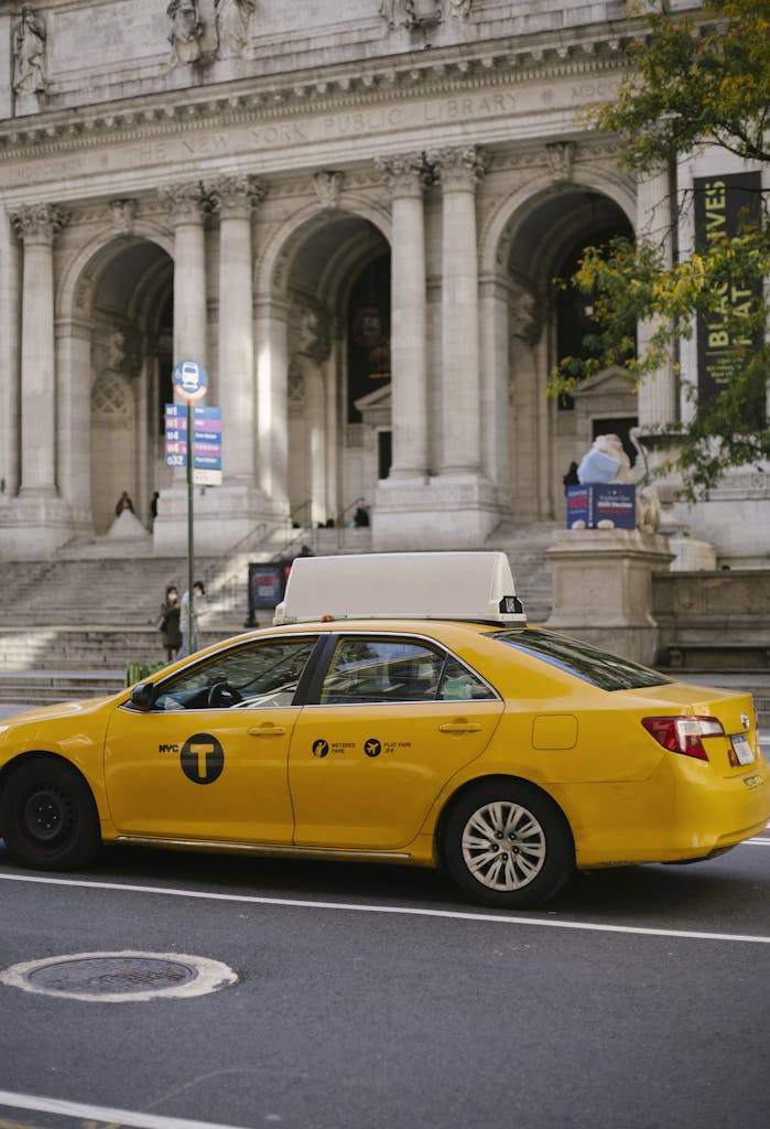 Modern yellow car riding along roadside